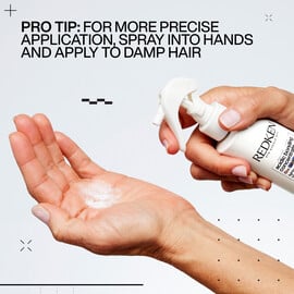 A woman spraying Redken Acidic Bonding Concentrate Lightweight Liquid Conditioner hair product into her hand.