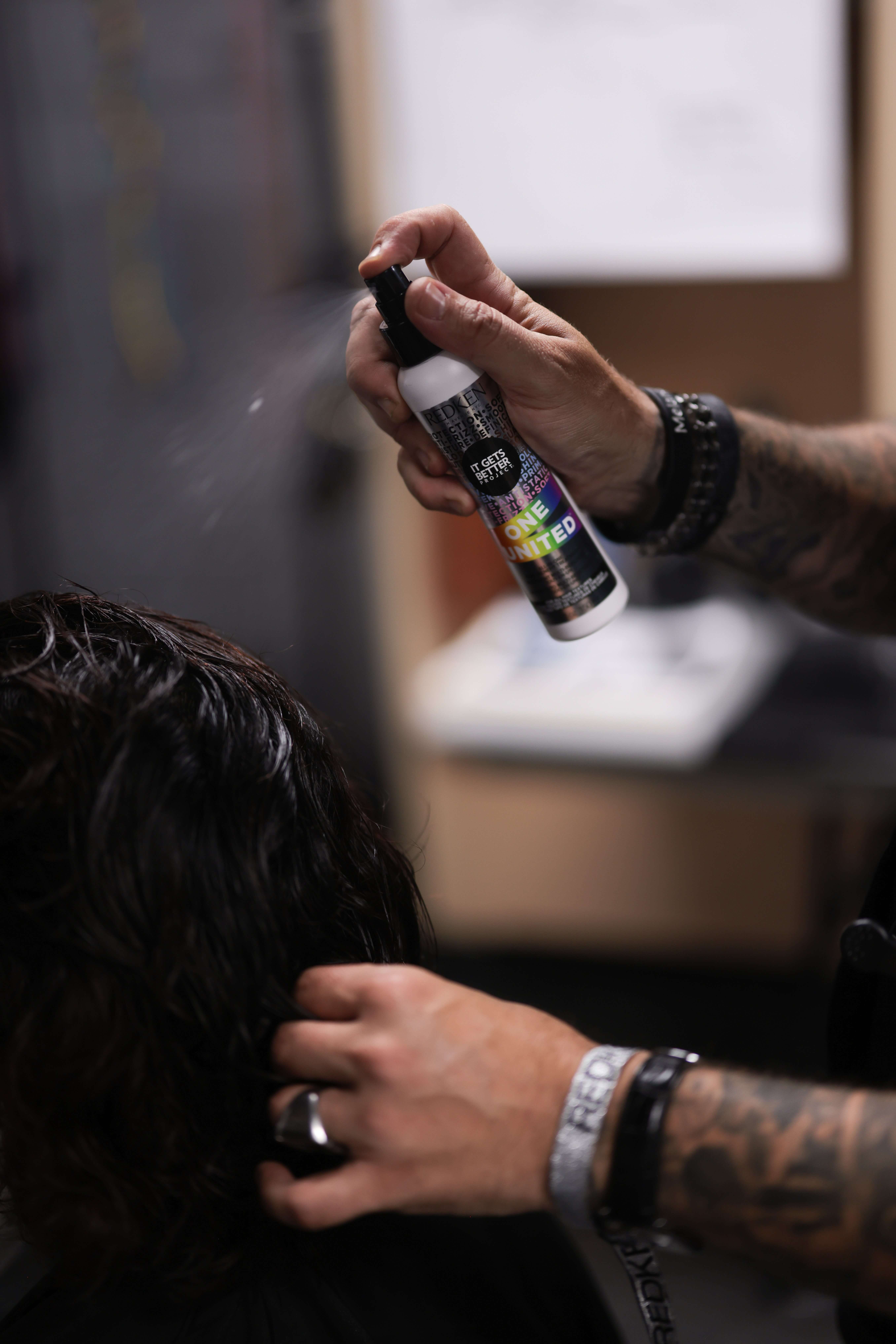 Redken Quick Blowout Heat Protectant and Black Blow Drier: Using a heat protectant is essential for healthy hair.