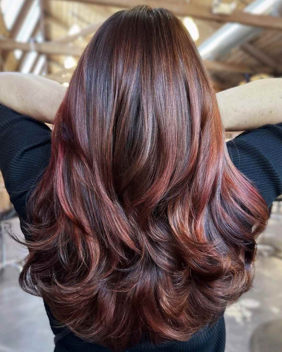 Rear view of long, wavy multi-tonal hair