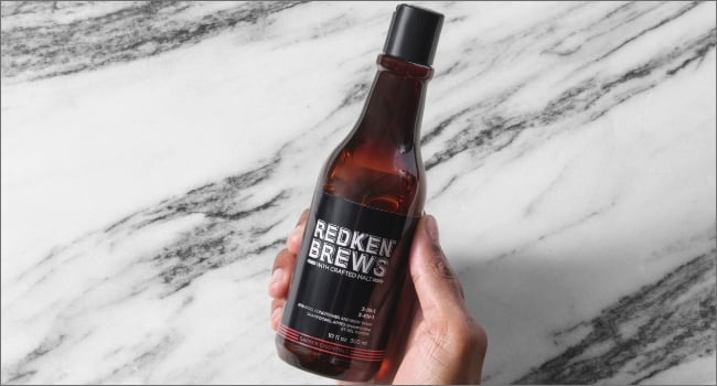 Discover Redken Brews 3-in-1 shampoo conditioner body wash in hand
