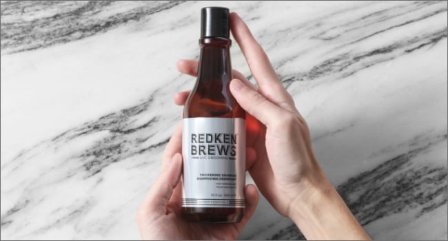Discover Redken Brews Thickening Shampoo In Hand