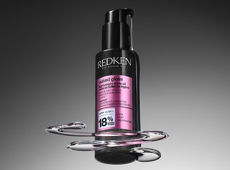 A bottle of Redken Naked Gloss Lightweight Shine OIl