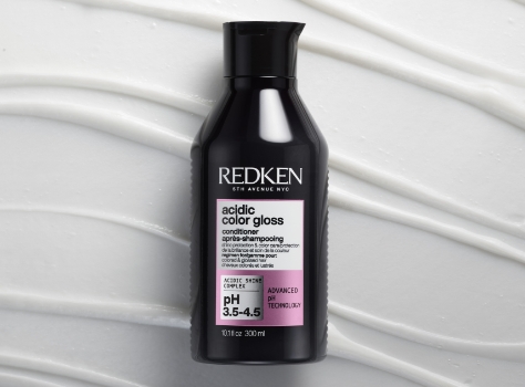 A bottle of Redken Acidic Gloss Conditioner.